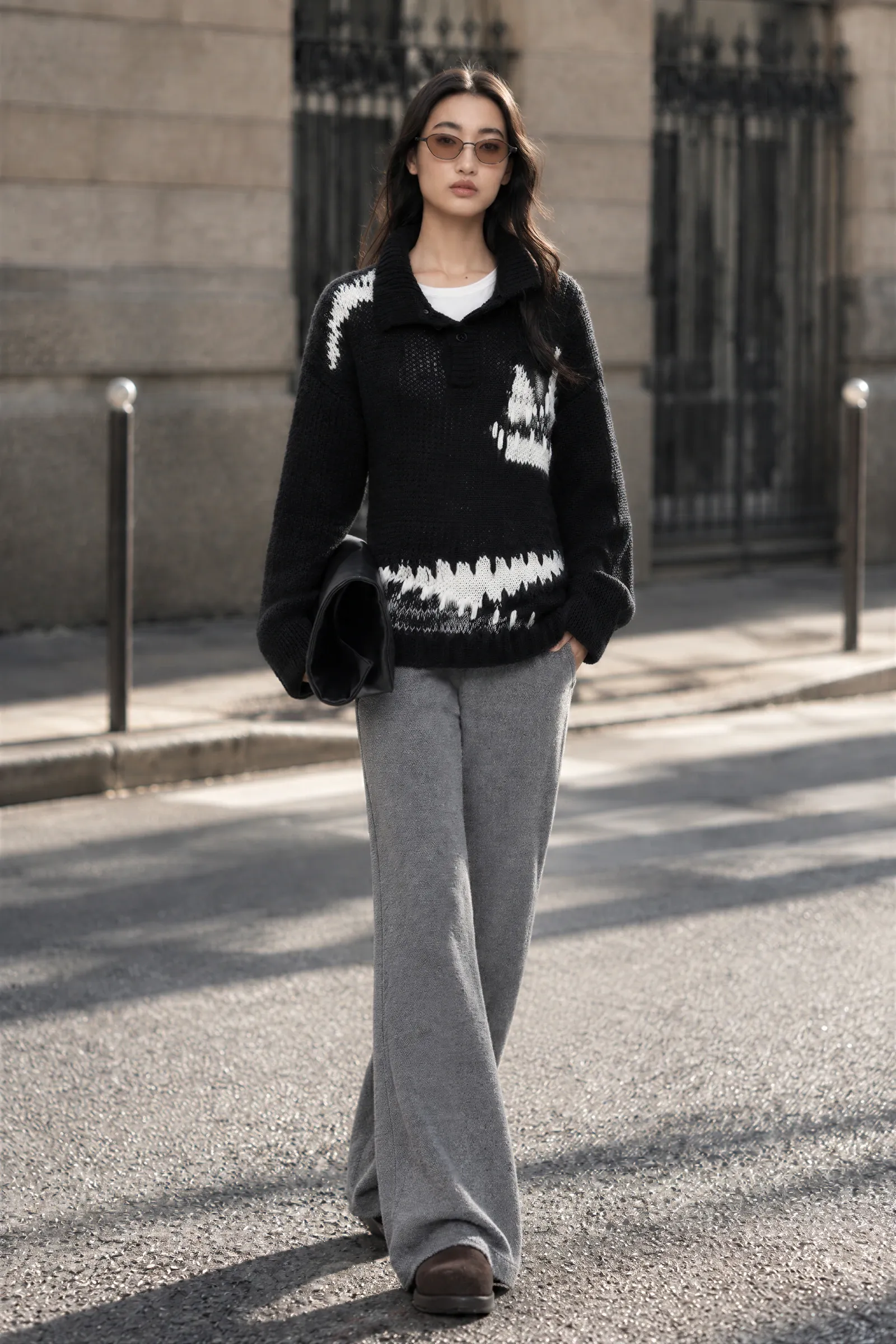 THESOONG black and white wool polo knit styled with relaxed grey trousers for a minimal autumn outfit